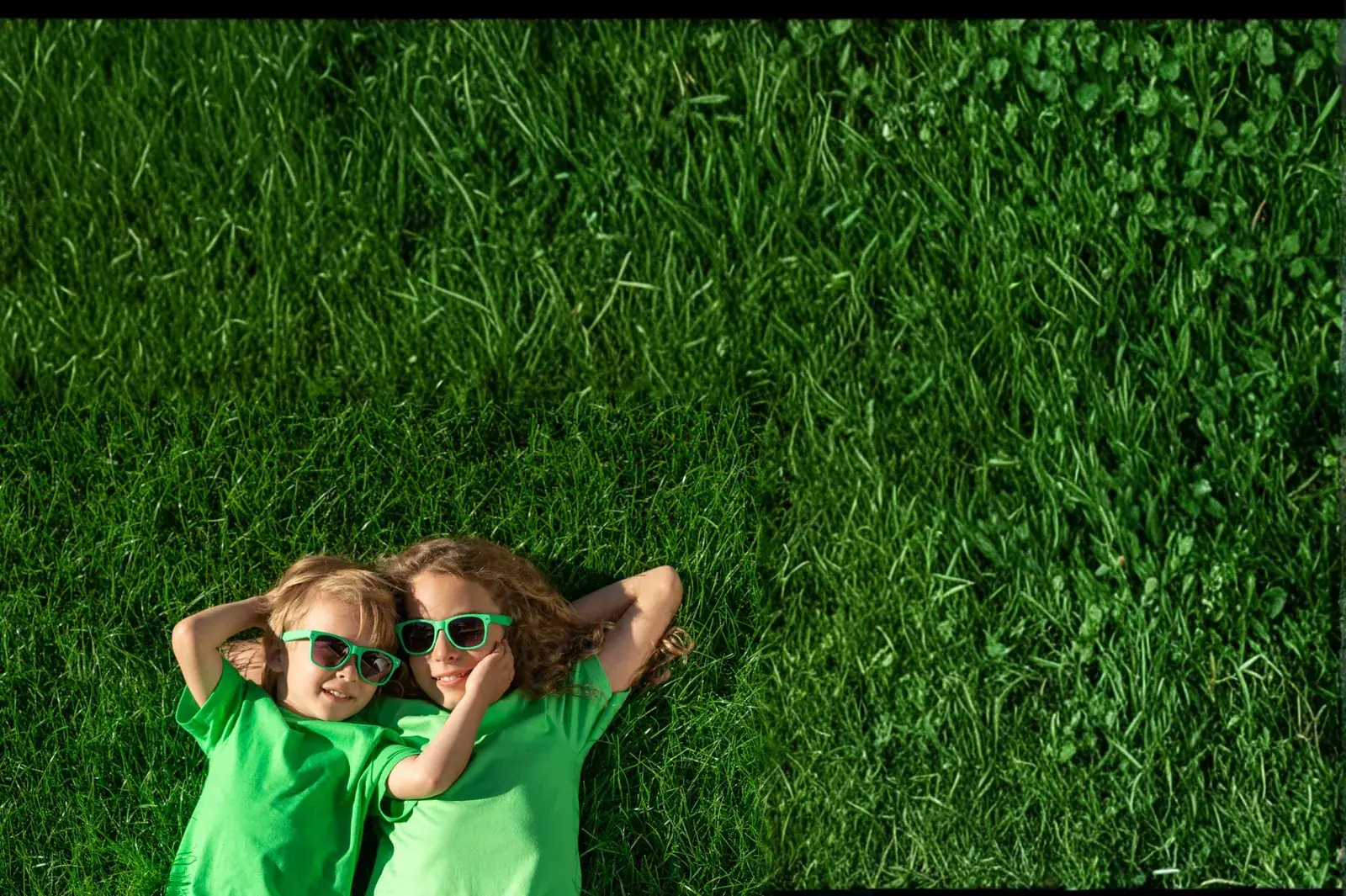 Kids playing on a beautiful green lawn