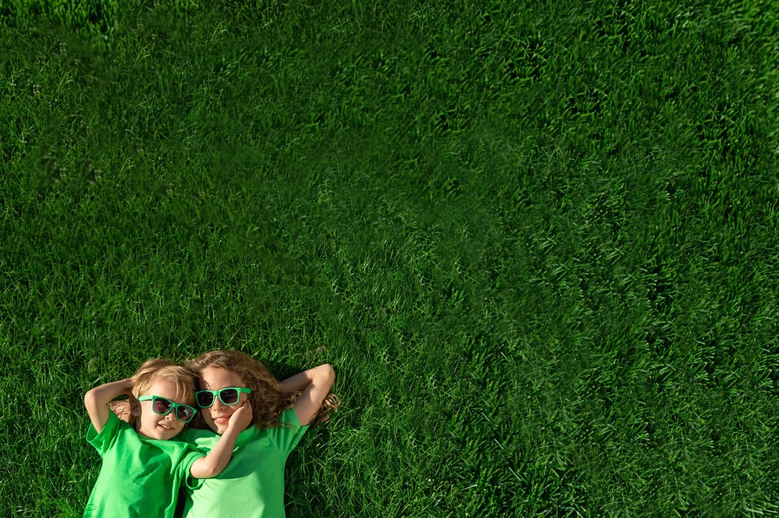 Kids playing on a beautiful green lawn